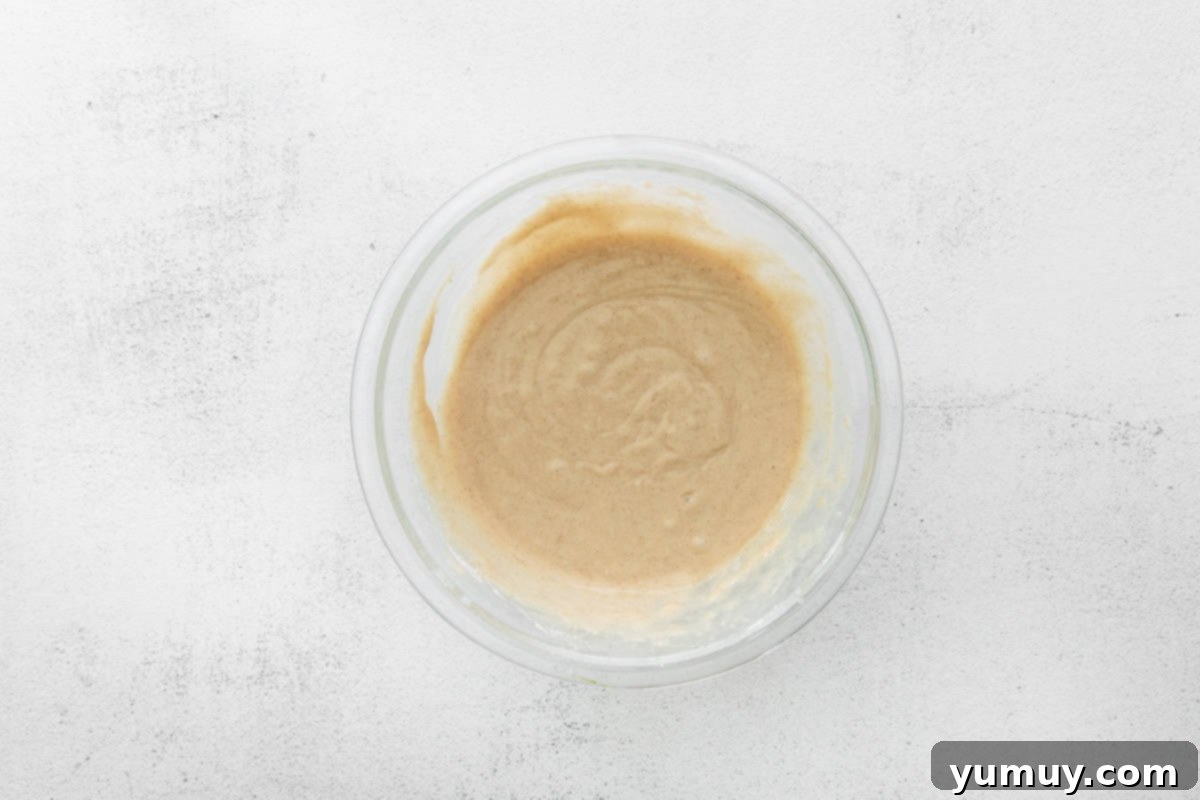 Decadent Tiramisu Cupcakes 13 tiramisu cupcake batter in a glass bowl.