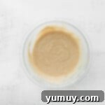 Decadent Tiramisu Cupcakes 6 tiramisu cupcake batter in a glass bowl.