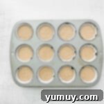 Decadent Tiramisu Cupcakes 7 a 12-count cupcake tin filled with cupcake batter.