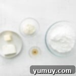 Decadent Tiramisu Cupcakes 8 ingredients for mascarpone frosting in individual bowls.