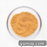 Flaky Pie Crust Apple Delights 6 Cinnamon and brown sugar mixture in a glass bowl, ready for filling.