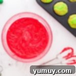 a bowl of red dyed frosting