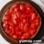 Decadent Chocolate Strawberry Delight 8 A single layer of chocolate cake generously topped with a perfectly piped ring of chocolate frosting, creating a dam to hold the luscious strawberry filling within.