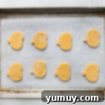 pumpkin shaped cookies no a baking tray, unbaked