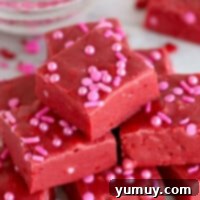 red velvet fudge pieces on platter topped with pink sprinkles.