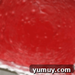 red velvet fudge in a lined baking pan.