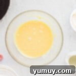 Frosty Peppermint Delight 6 Smooth white chocolate ganache glistening in a glass bowl.