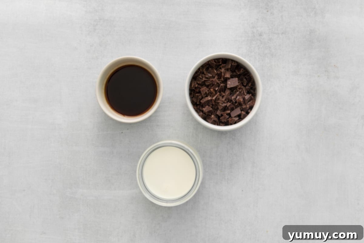 Overhead view of ganache ingredients perfectly arranged in pristine white and clear glass bowls.