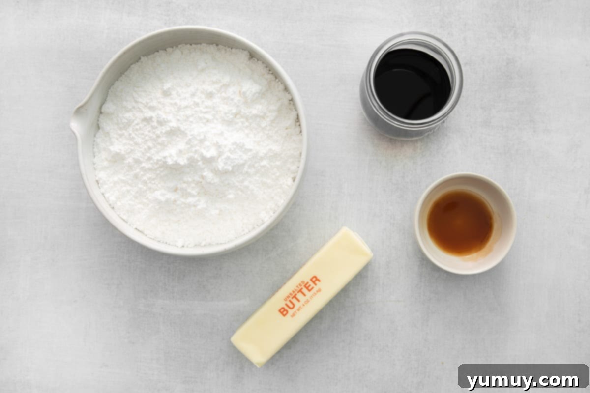 Overhead view of ingredients for Kahlua buttercream in white and glass bowls, precisely measured for a perfect frosting.