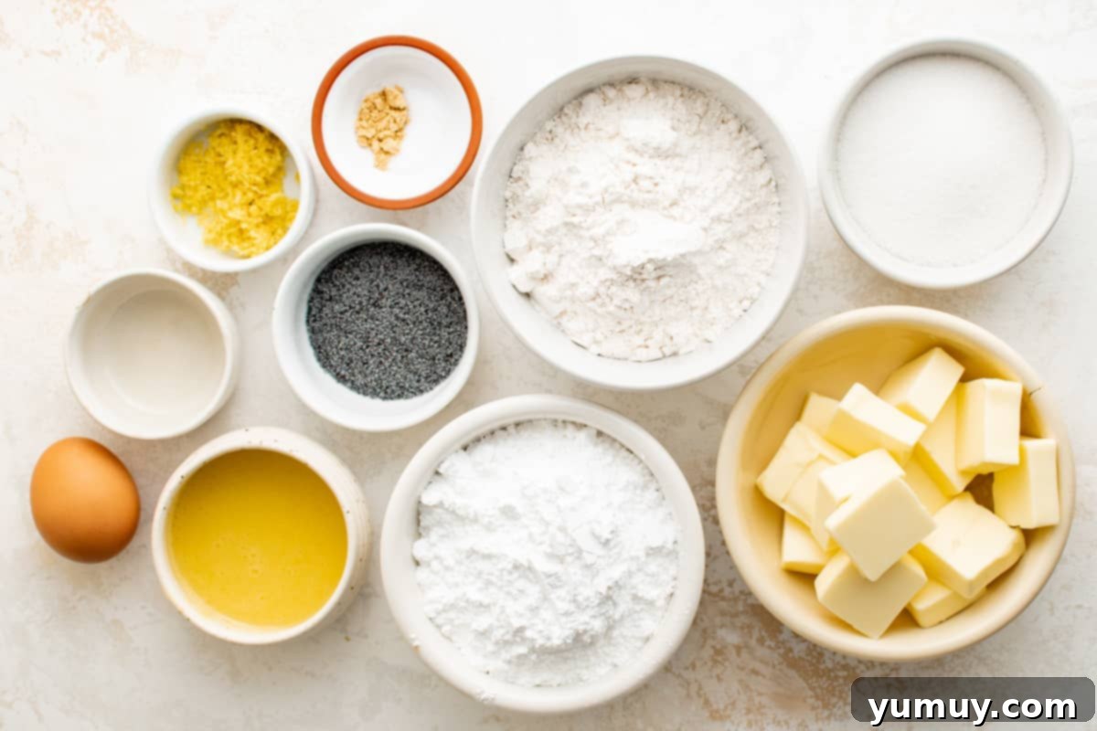 Tangy Lemon Curd Delights 10 All the fresh ingredients for lemon curd cookies, including butter, eggs, flour, and lemons, neatly arranged on a kitchen counter.