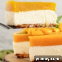 A vibrant slice of no-bake mango cheesecake, showcasing its light, creamy filling, crunchy vanilla wafer crust, and glistening mango jam, ready to be served.