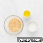 Vanilla wafer cookies finely crushed into crumbs in a food processor, ready for the cheesecake crust.