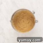 smores cake batter in a stainless mixing bowl.