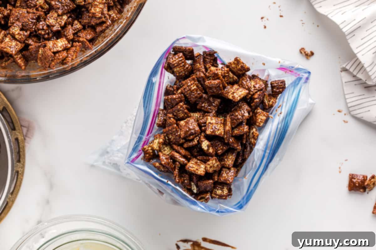 DIY Puppy Chow Perfection 11 Chocolate-coated cereal being added to a bag of powdered sugar.