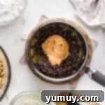 DIY Puppy Chow Perfection 6 A bowl of food with a spoon and a bowl of food.