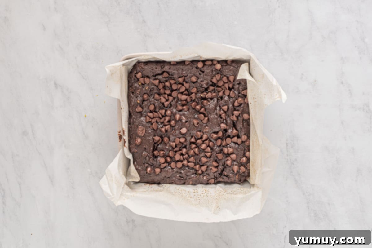 Emerald Fudge Brownies 16 baked avocado brownies in a square baking pan.