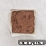 Emerald Fudge Brownies 9 avocado brownie batter spread into a square baking pan.