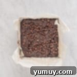 Emerald Fudge Brownies 10 baked avocado brownies in a square baking pan.