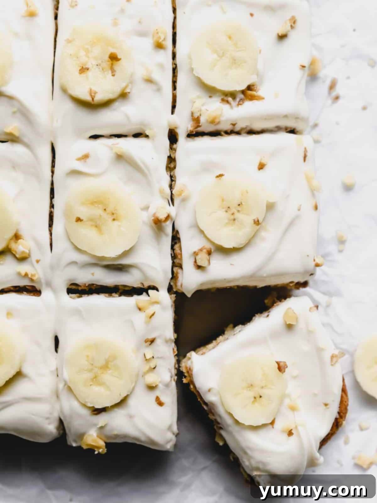 close up of cut banana cake with the bottom right slice askew.