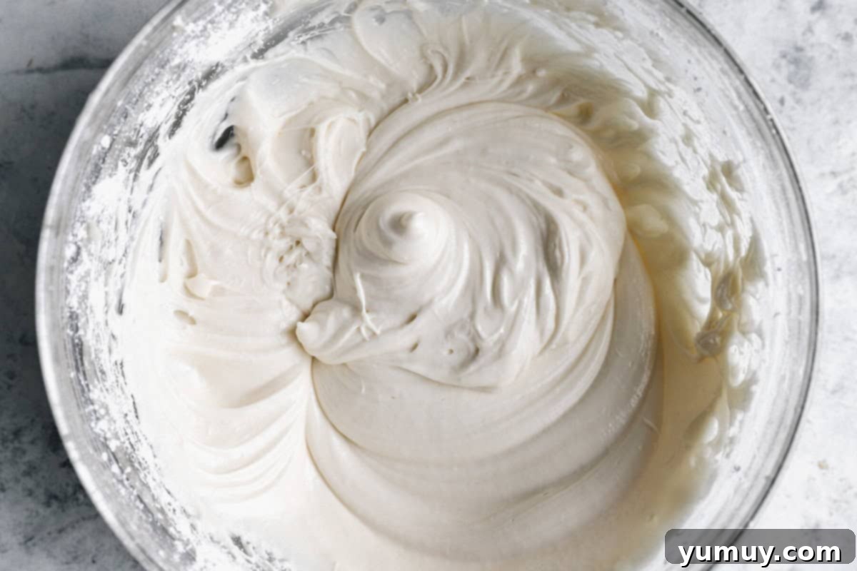 cream cheese frosting in a glass bowl.