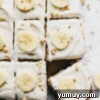 close up of cut banana cake with the bottom right slice askew.