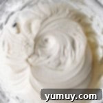 cream cheese frosting for banana cake in a glass bowl.
