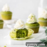 A perfectly frosted matcha cupcake, ready to be enjoyed.