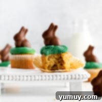 Featured Easter bunny cupcakes, beautifully frosted and topped with chocolate bunnies.