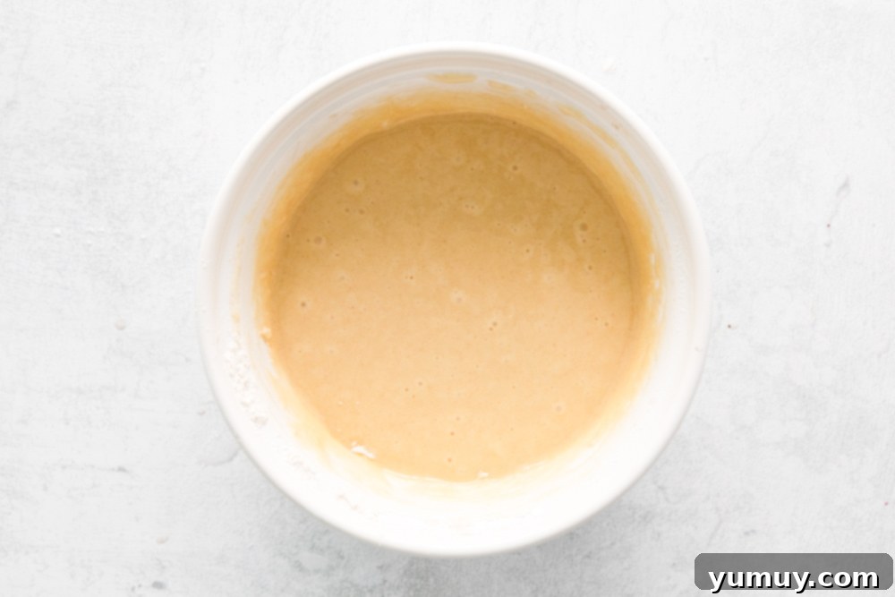 overhead view of batter for easter cupcakes in a white bowl.