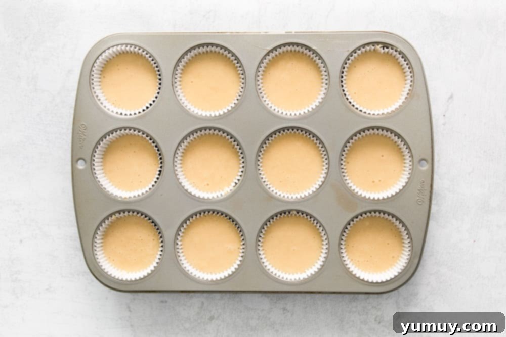 easter cupcake batter in the wells of a cupcake tin.
