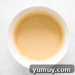 overhead view of batter for easter cupcakes in a white bowl.