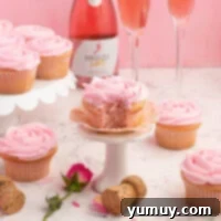 Featured pink moscato cupcakes, elegantly frosted and garnished, ready to be enjoyed.