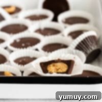 Chocolate peanut butter cups in a baking pan, ready to be chilled.