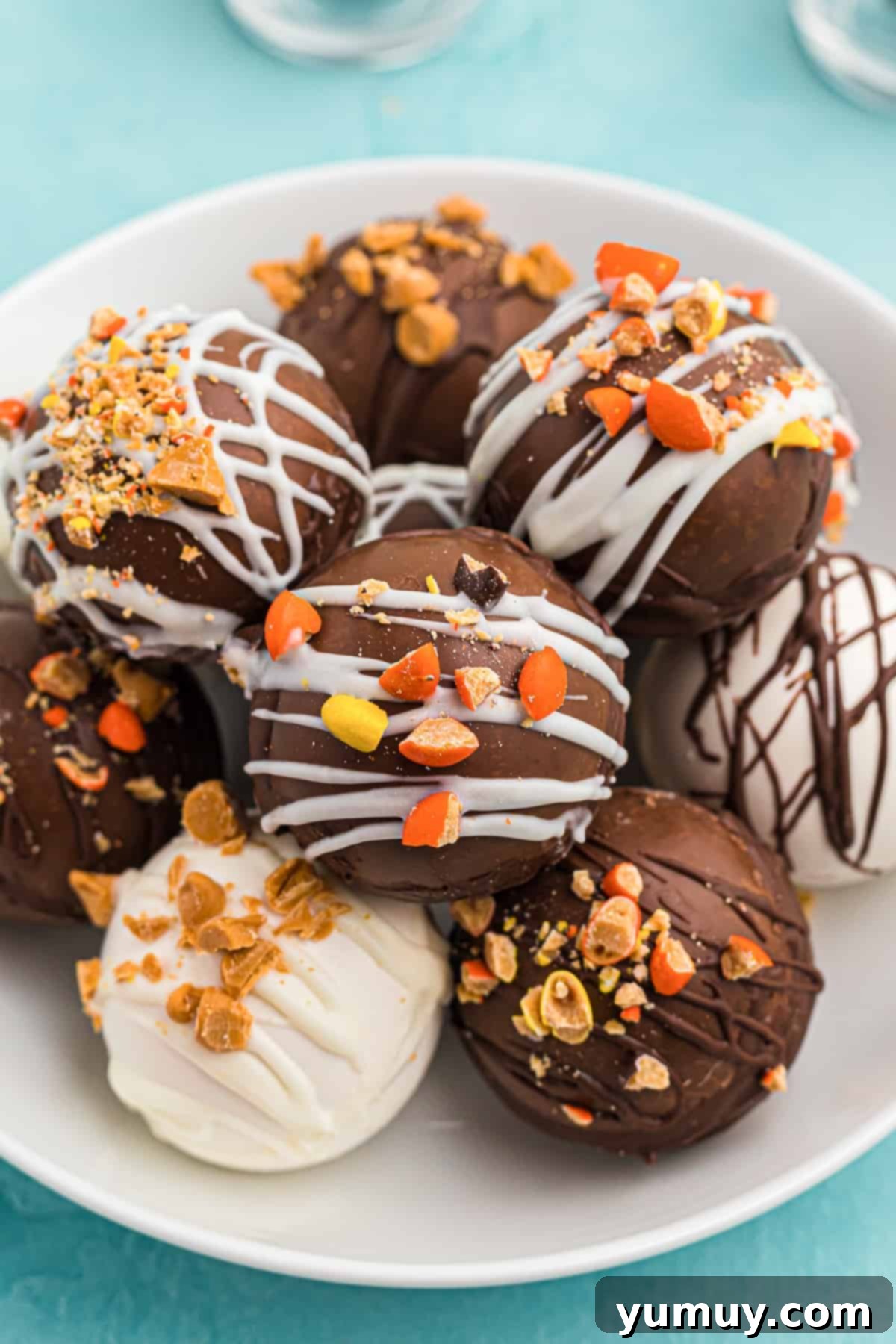 hot cocoa bombs with candy pieces on plate