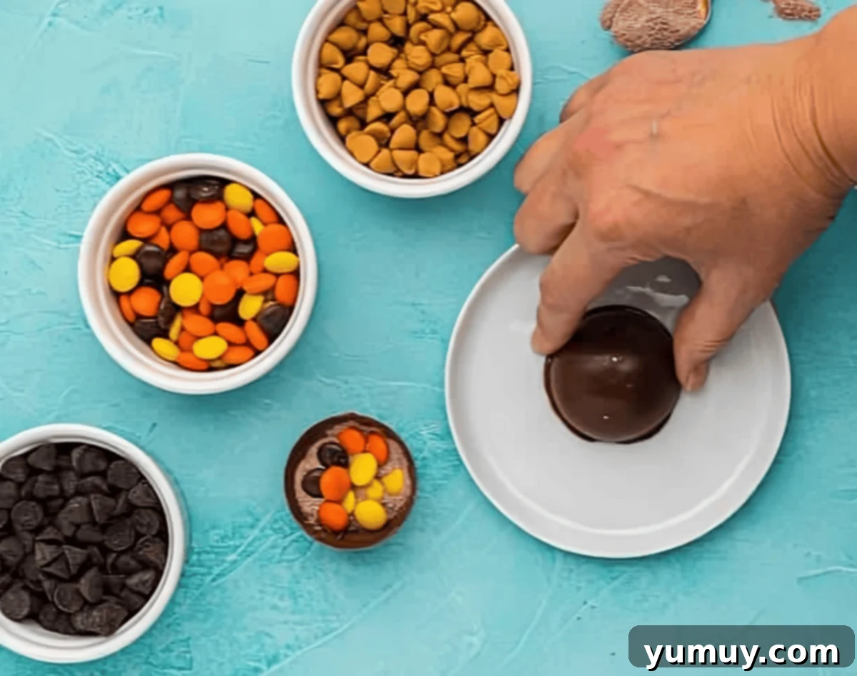 melting half spheres of chocolate on a hot plate.