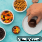 melting half spheres of chocolate on a hot plate.