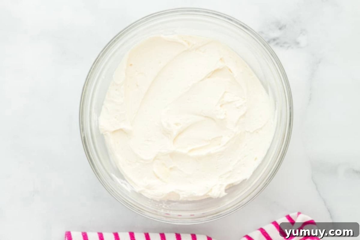 white frosting in a glass bowl.