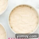 cake batter in round cake pans.