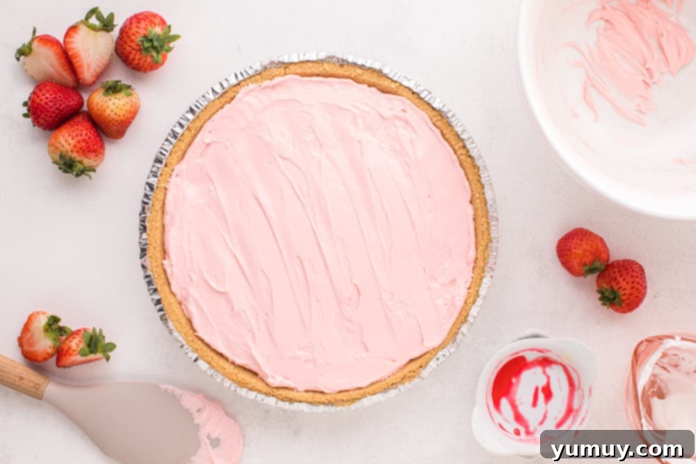 overhead view of kool aid pie in an aluminum disposable pie crust.