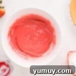 condensed milk strawberry filling in a white bowl.
