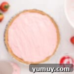 overhead view of kool aid pie in an aluminum disposable pie crust.