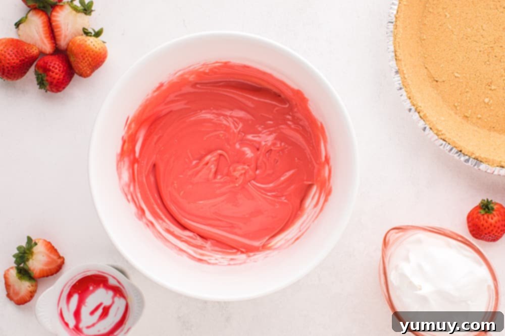 condensed milk strawberry filling in a white bowl.