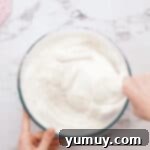 Airy Dream Cake 8 folding flour into beaten egg whites with a rubber spatula.