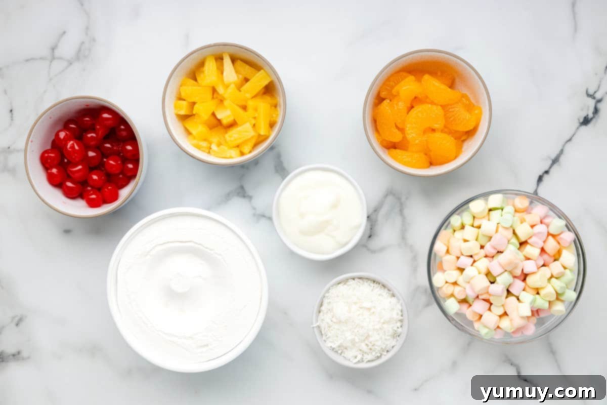 A collection of ambrosia salad ingredients including canned fruits, marshmallows, and coconut in separate bowls.