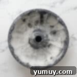 Bursting Blueberry Bundt 5 A greased and floured bundt cake pan, ready for batter.