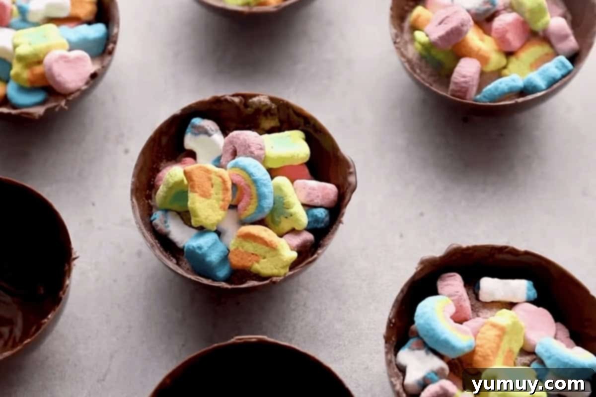 Magical Lucky Charms Hot Cocoa Bombs 13 Chocolate half-spheres filled with hot chocolate mix and colorful Lucky Charms marshmallows.