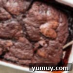 spoon in pan of chocolate cobbler