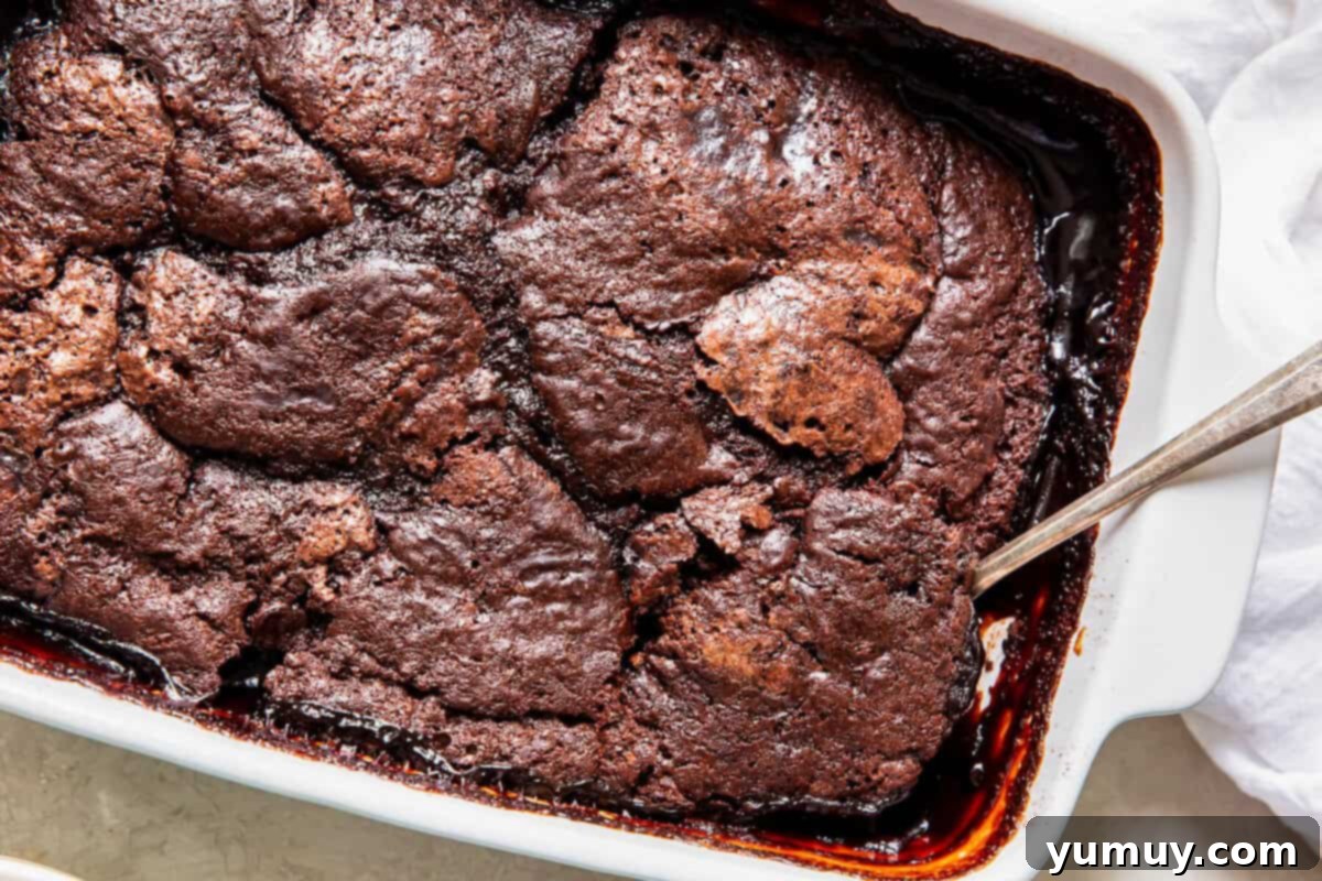 spoon in pan of chocolate cobbler