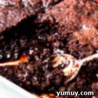 spoon in pan of chocolate cobbler