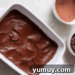 chocolate cobbler batter in a baking dish.